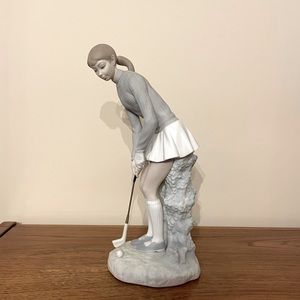 Lladro women’s golfer figurine.